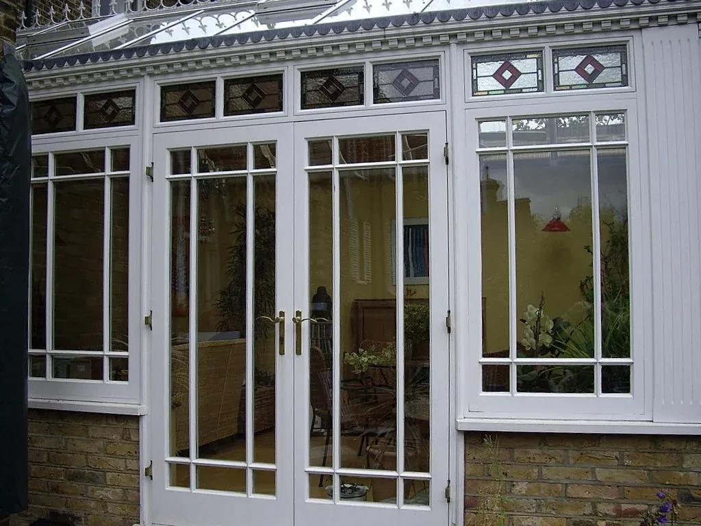 White timber conservatory with French doors