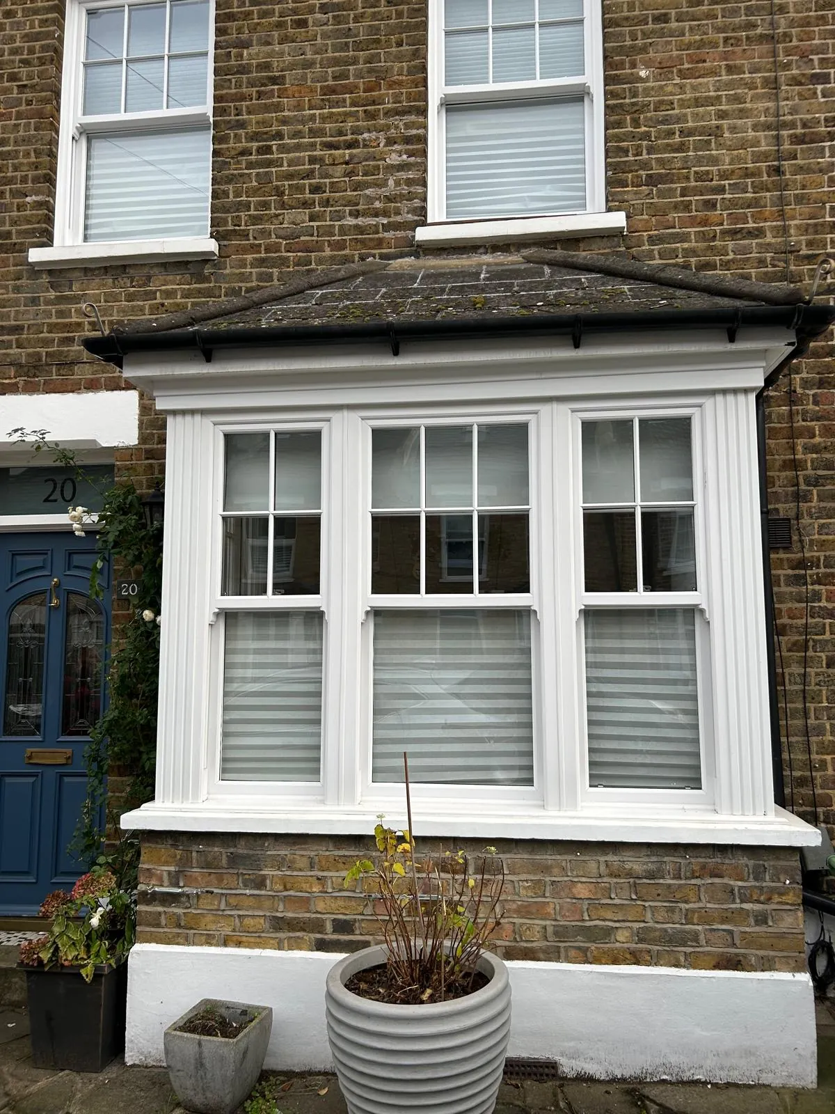 White timber sash windows in a bay on a Victorian house