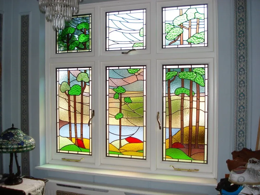 White timber windows with Arts and Crafts stained glass